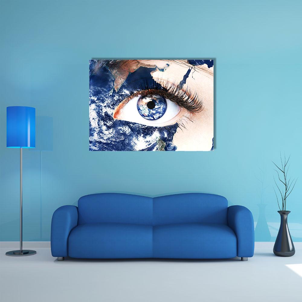 Human Eye with Earth Iris Canvas Wall Art in white, beige and blue, single panel hung on a wall