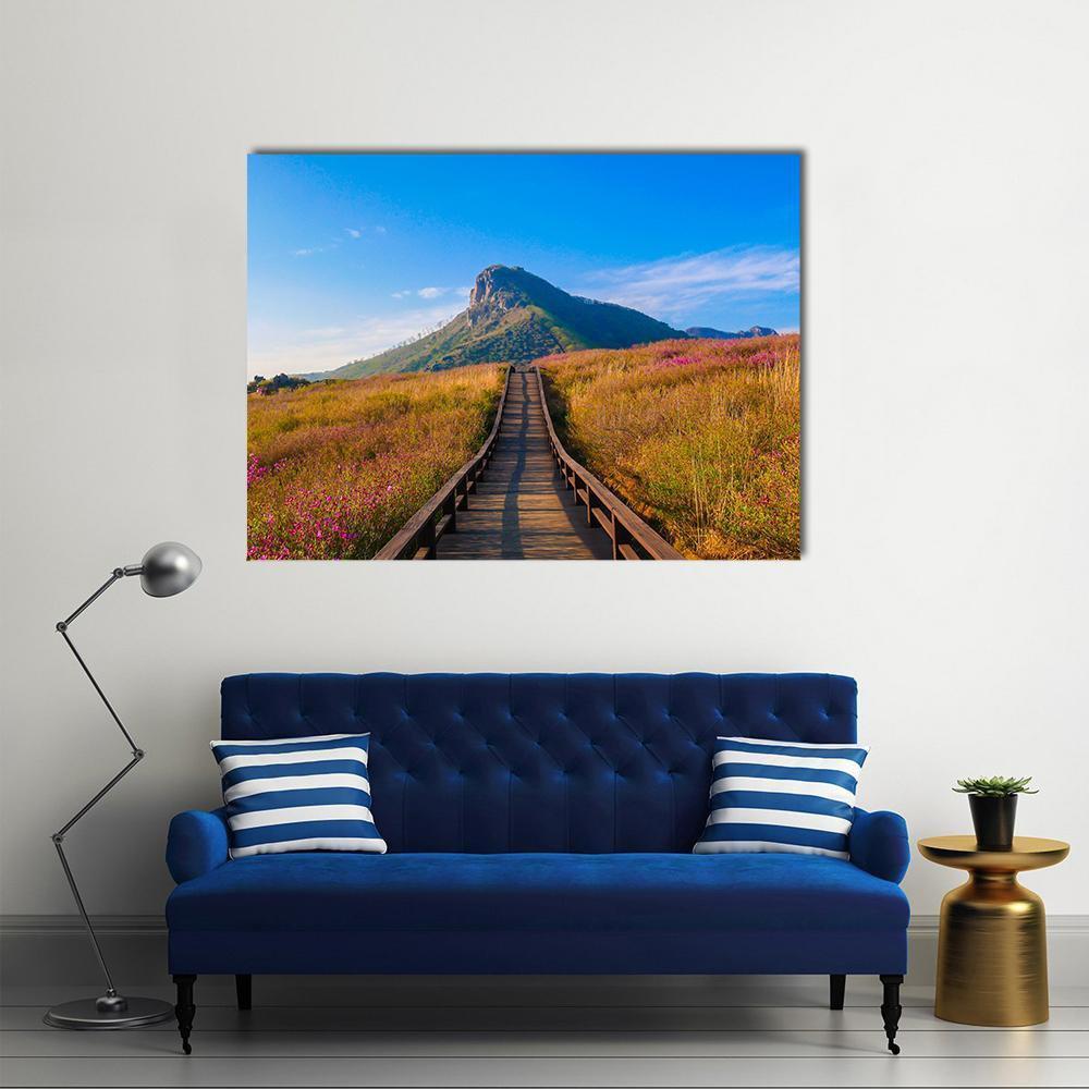 Hwangmaesan Mountain Boardwalk with Wildflowers Canvas Wall Art in brown, green and blue, single panel hung on a wall