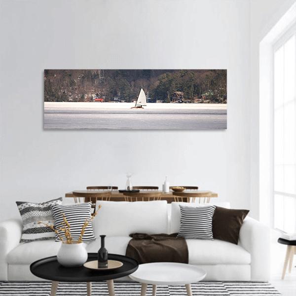 Ice Sailboat on Frozen Lake Panoramic Canvas Wall Art in white, gray and brown, hung on a wall