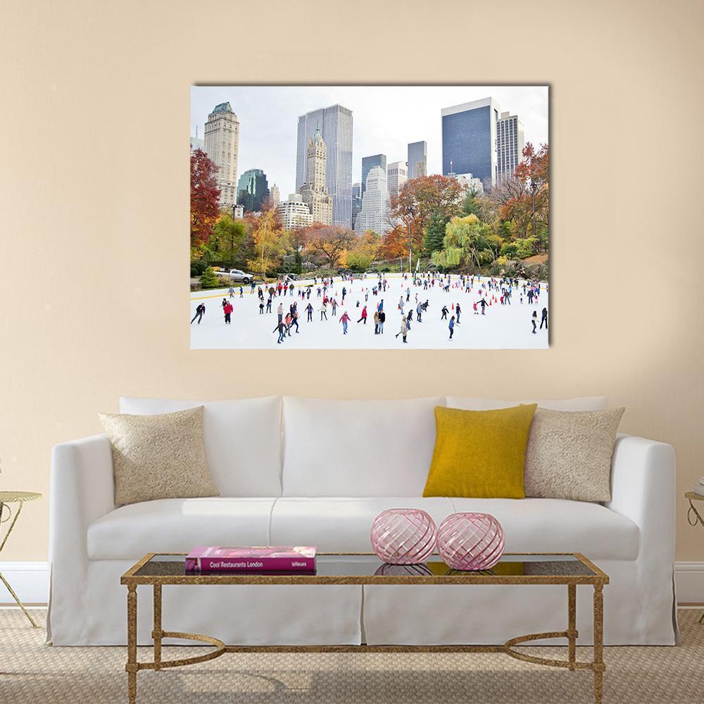 Ice Skaters at Wollman Rink, Central Park Canvas Wall Art in white, gray and blue, single panel hung on a wall
