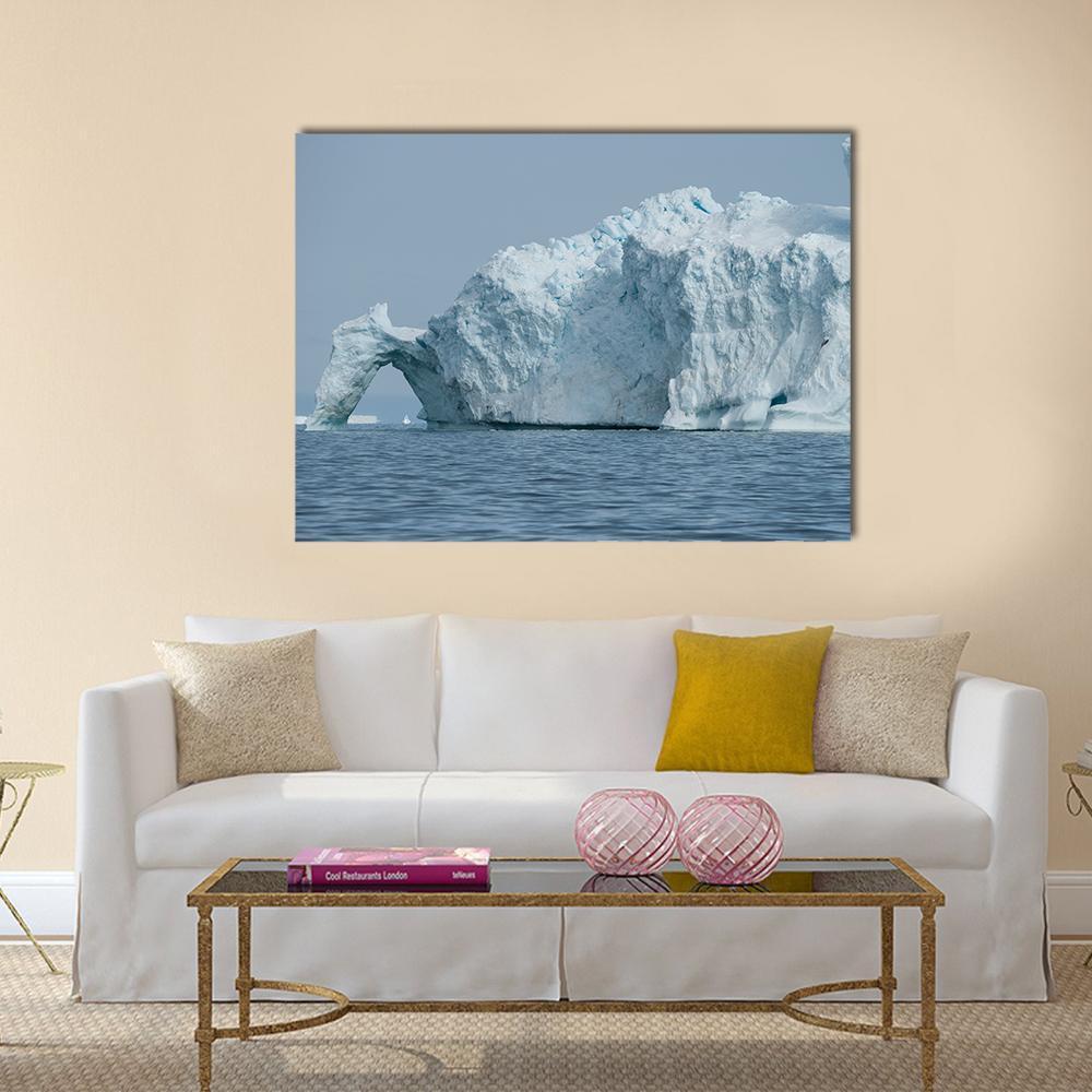 Iceberg with Natural Archway in Disko Bay Canvas Wall Art in white and blue, single panel hung on a wall