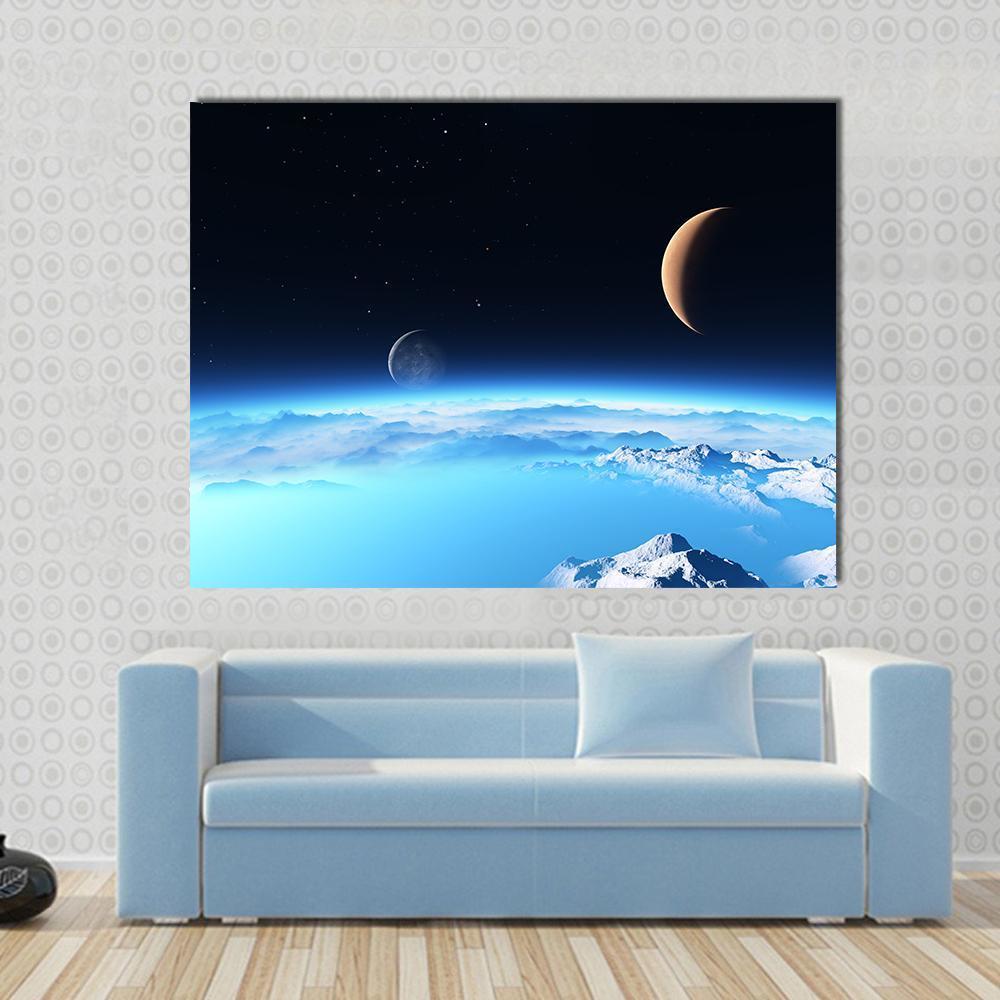 Icy Planet with a Moon Canvas Wall Art in black, white and blue, single panel hung on a wall