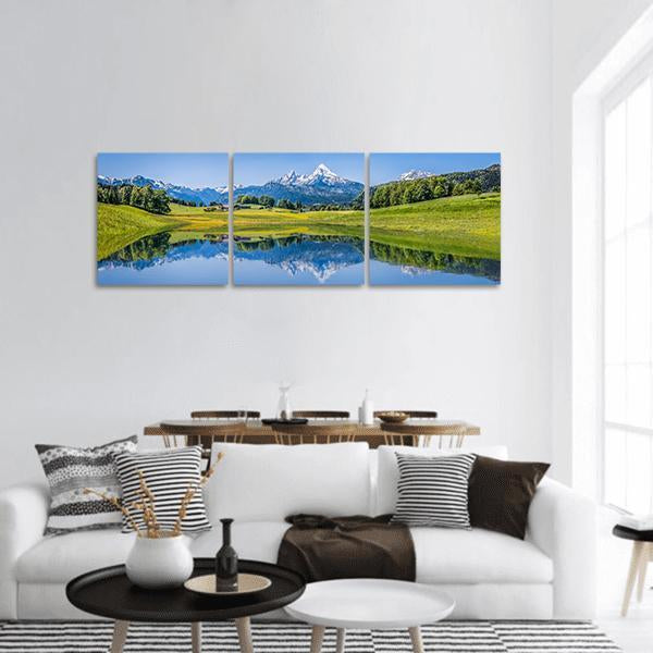 Idyllic Summer Mountain Lake Landscape Panoramic Canvas Wall Art in green and blue, hung on a wall