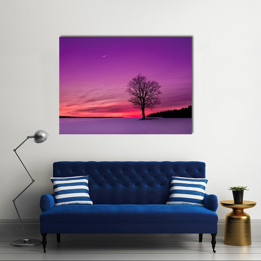 Twilight Field with Crescent Moon Canvas Wall Art in black, purple and pink, single panel hung on a wall