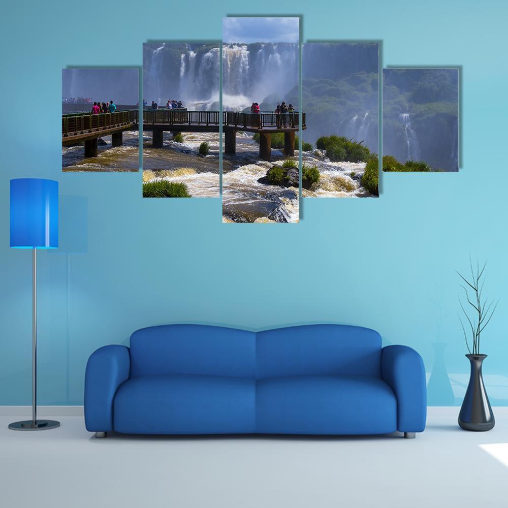 Iguassu Falls Overlook Canvas Wall Art in brown, green and blue, 5 panel Star layout hung on a wall