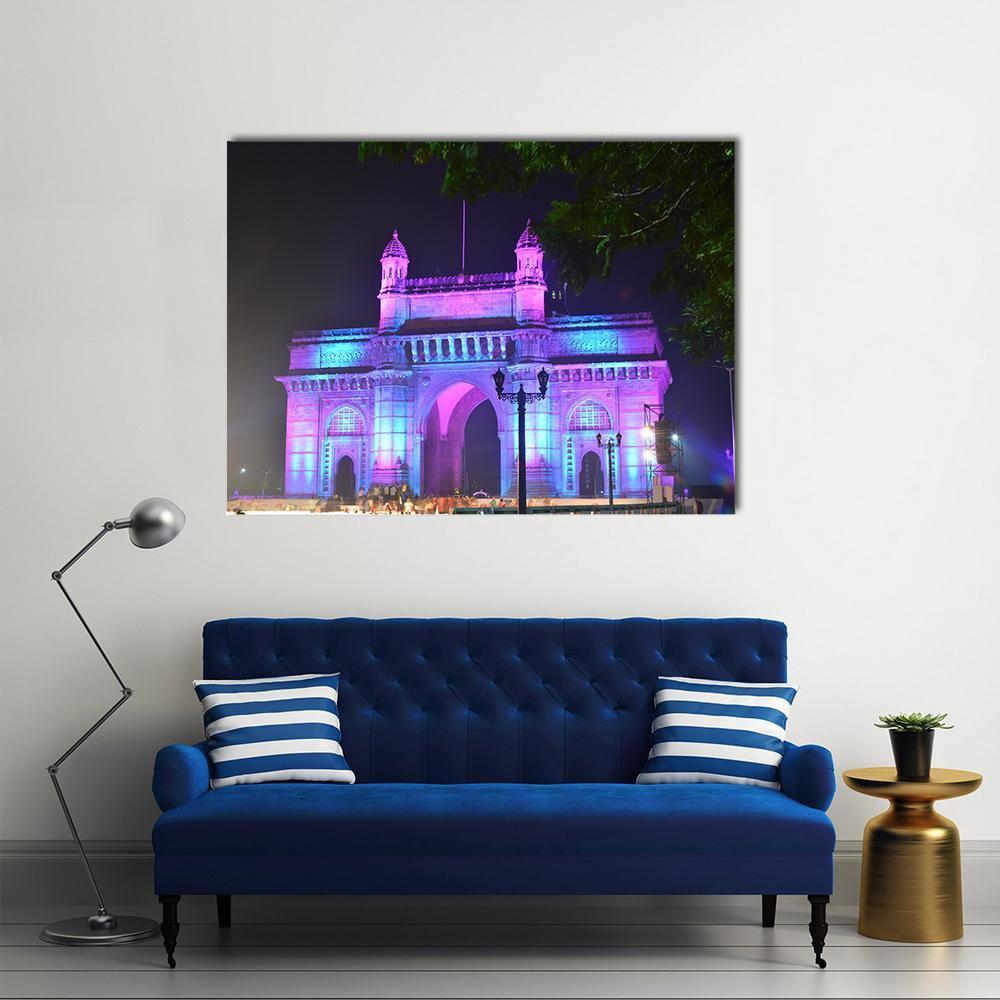 Illuminated Gateway of India, Mumbai Canvas Wall Art in black, blue and purple, single panel hung on a wall