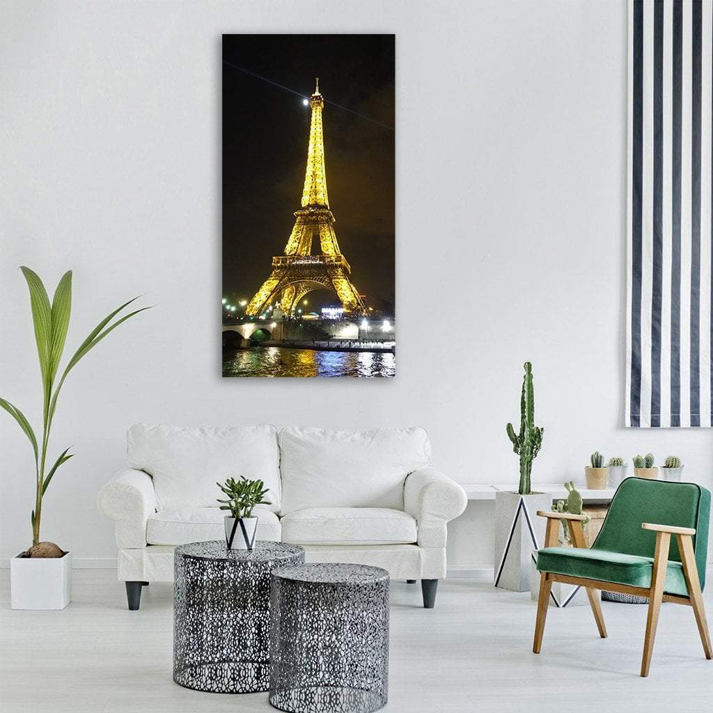 Illuminated Eiffel Tower with Moon Vertical Canvas Wall Art in black, gold and yellow, single vertical panel hung on a wall