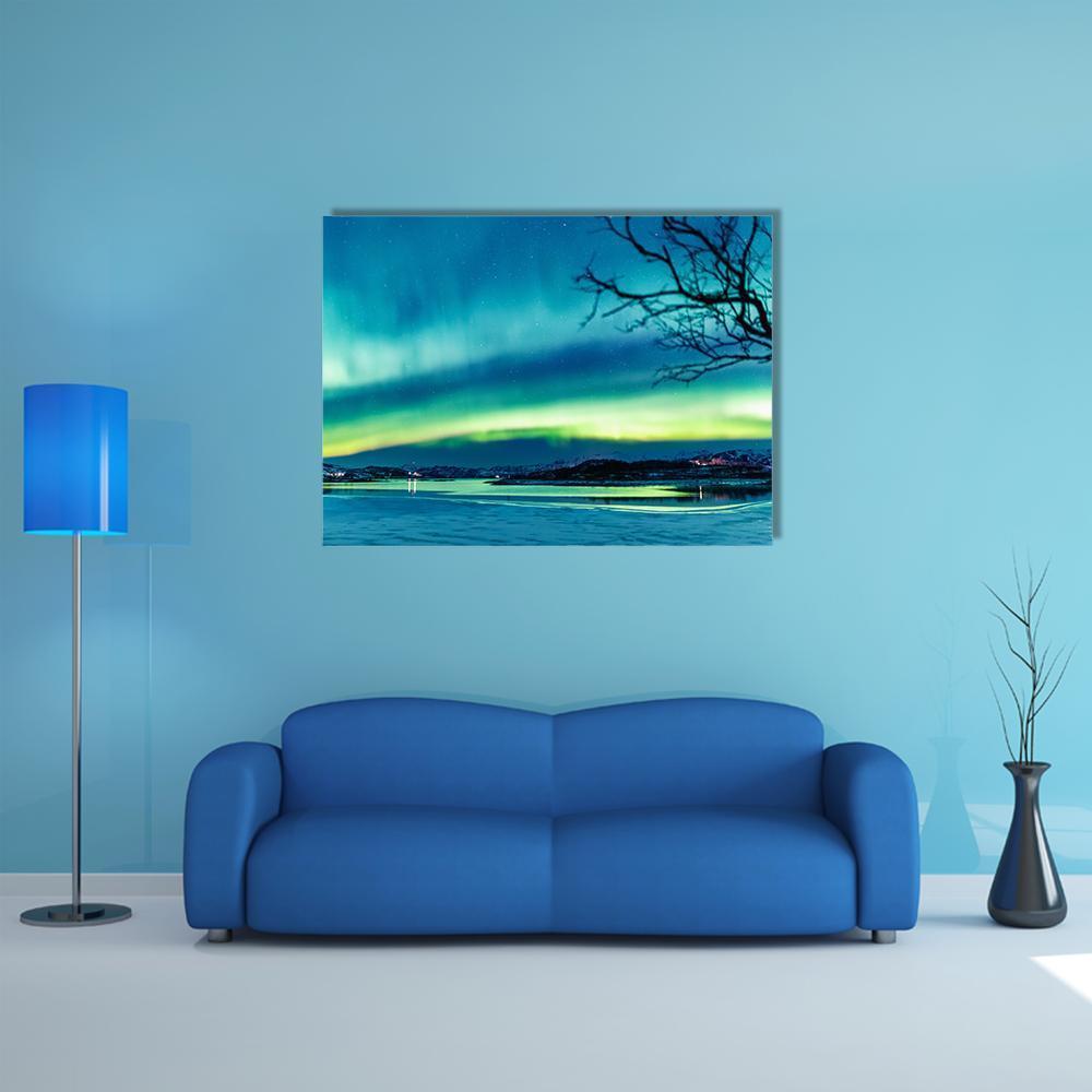 Aurora Over Mountain Lake Canvas Wall Art in green and blue, single panel hung on a wall