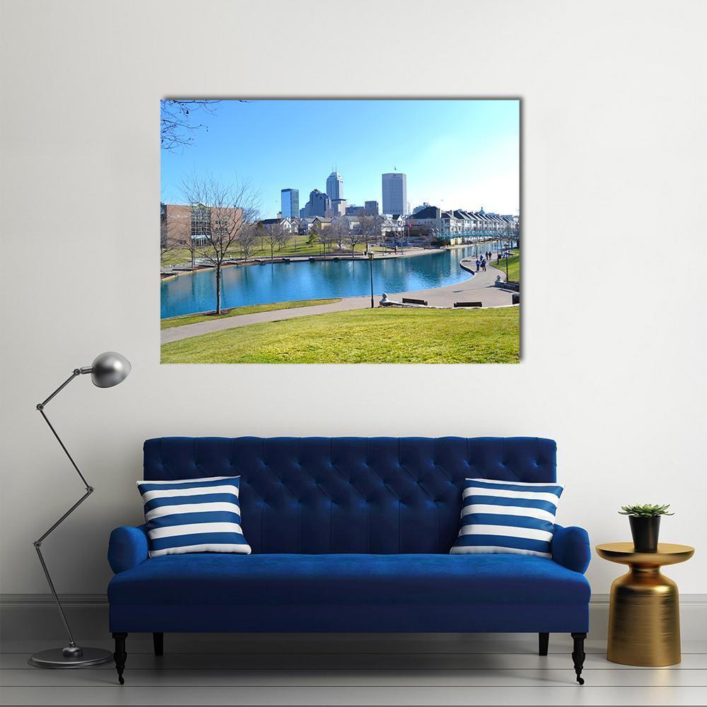 Indiana Canal and City Skyline Canvas Wall Art in green and blue, single panel hung on a wall