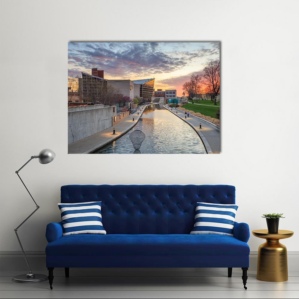 Indiana State Museum Canal with Wire Sculpture Canvas Wall Art in gray, orange and blue, single panel hung on a wall