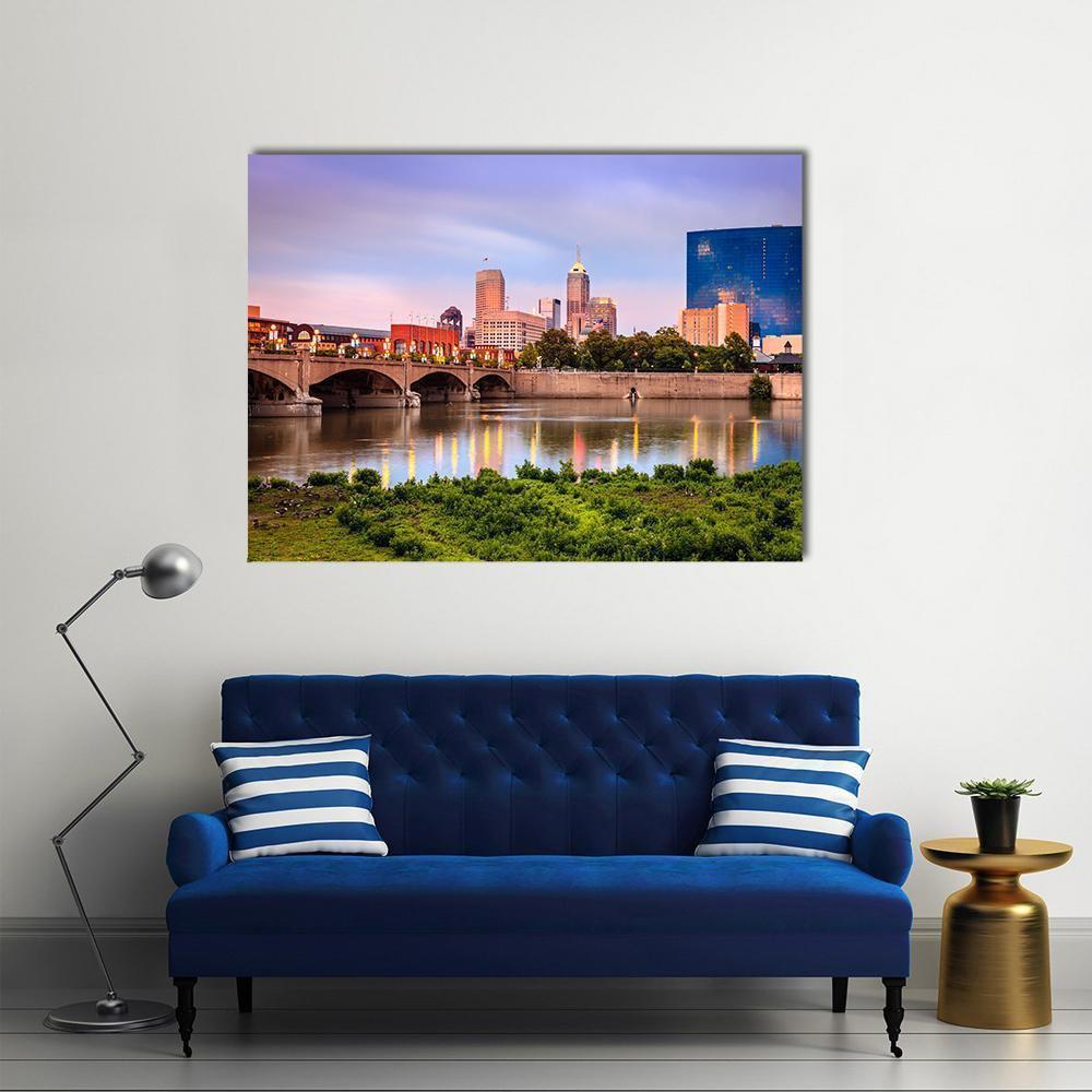 Indianapolis Skyline at Sunset Canvas Wall Art in green, blue and purple, single panel hung on a wall