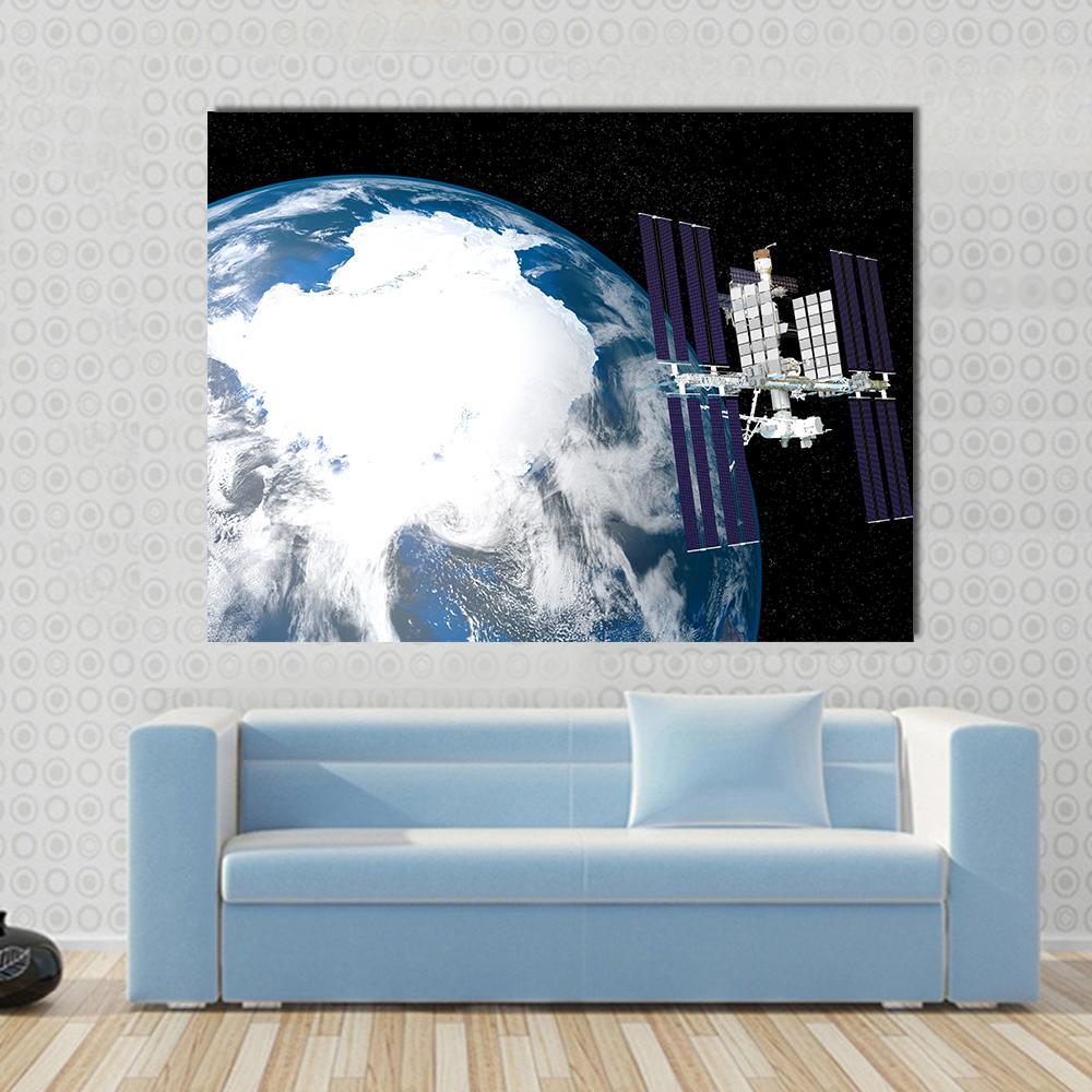 International Space Station Canvas Wall Art in black, white and blue, single panel hung on a wall