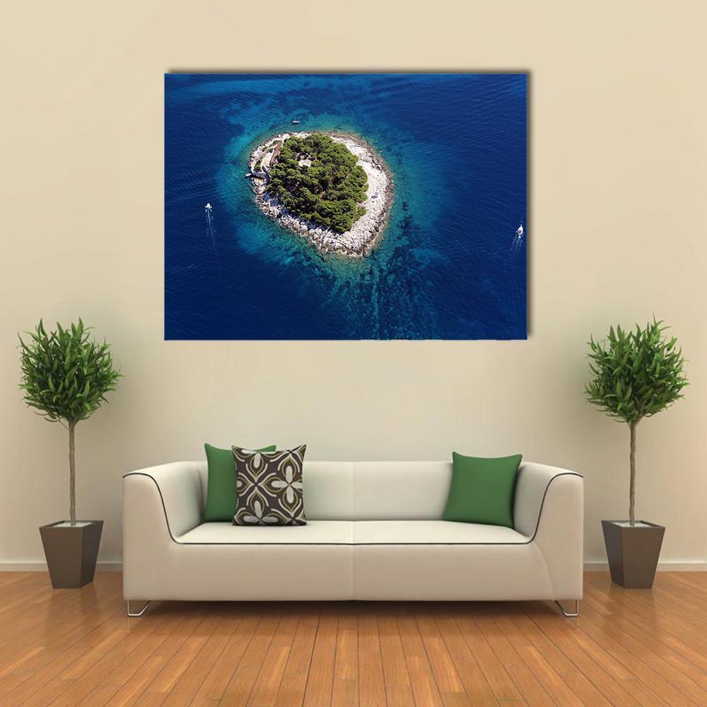 Aerial View of Tree-covered Island and Boats Canvas Wall Art in green and blue, single panel hung on a wall