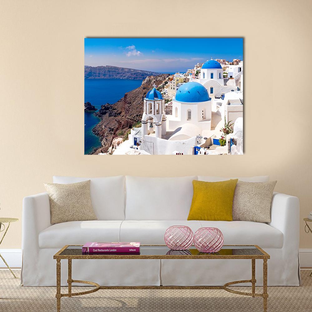 Oia Santorini Blue-domed Village Canvas Wall Art in white and blue, single panel hung on a wall