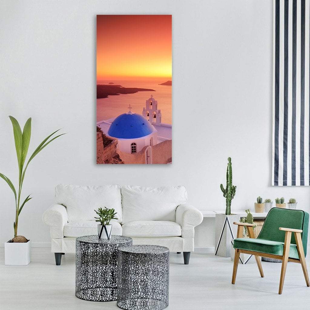 Santorini Blue Dome Over Caldera at Sunset Vertical Canvas Wall Art in white, orange and blue, single vertical panel hung on a wall