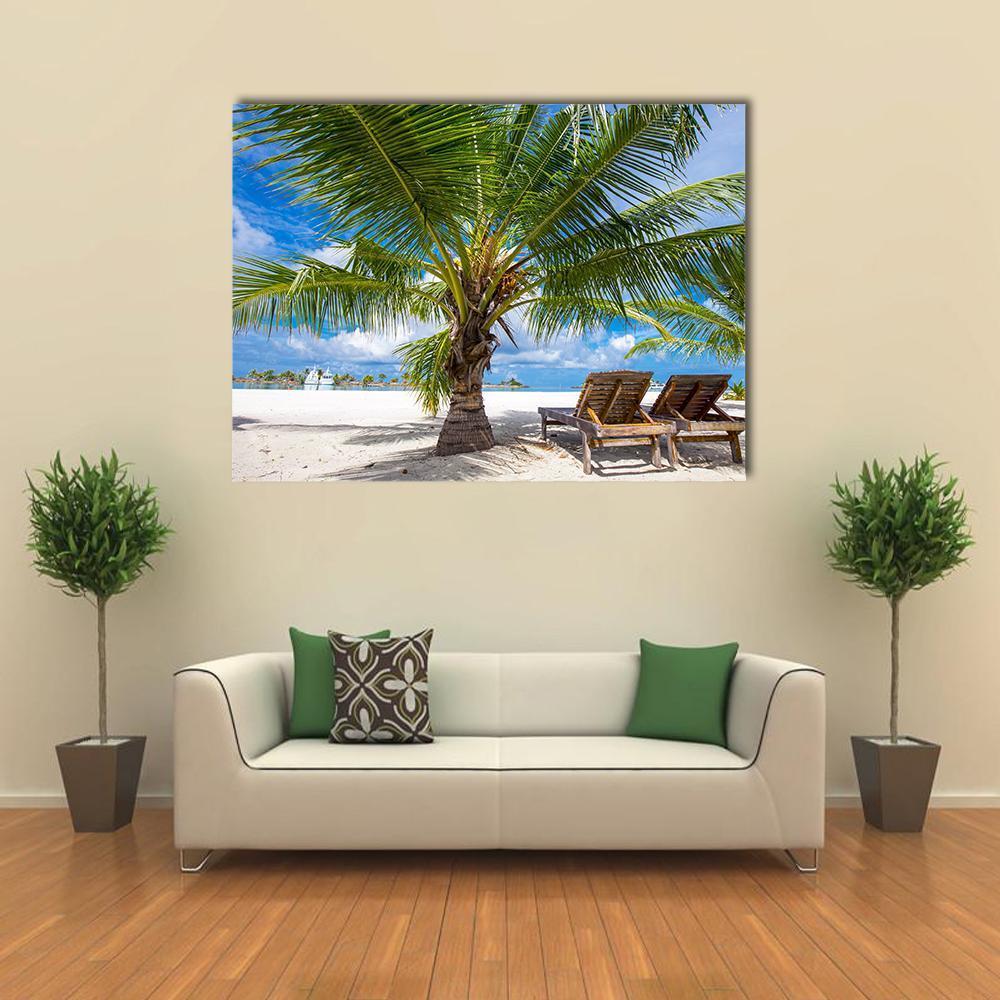 Tropical Island View with Palm Tree Canvas Wall Art in white, green and blue, single panel hung on a wall