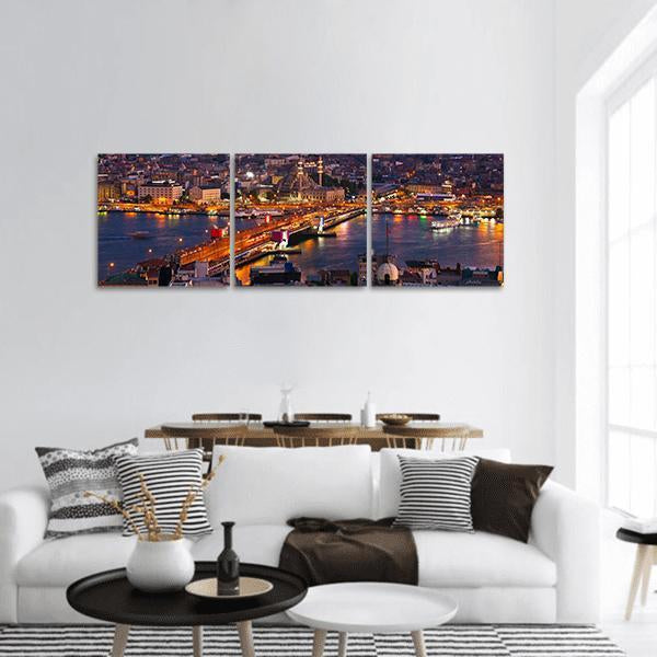 Istanbul Night Skyline with Galata Bridge Panoramic Canvas Wall Art in black, orange and blue, hung on a wall