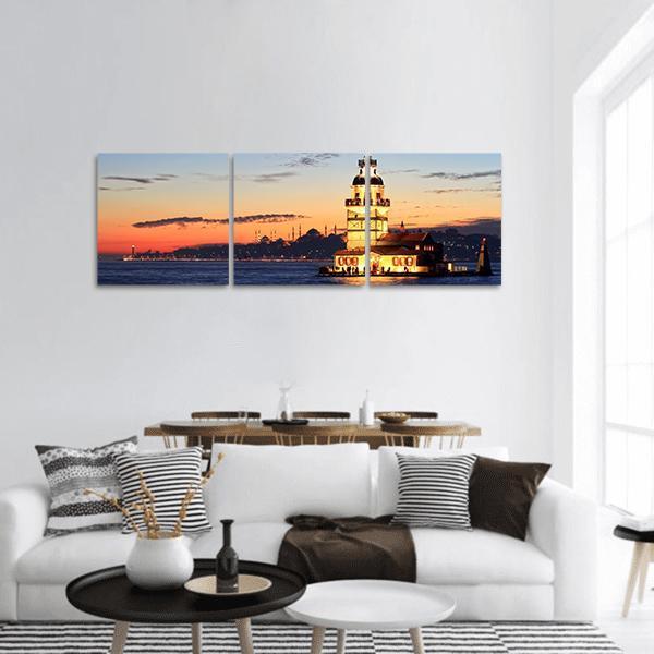 Istanbul Maiden's Tower at Sunset Panoramic Canvas Wall Art in orange, yellow and blue, hung on a wall