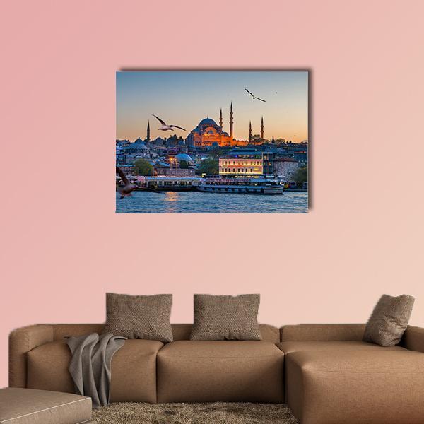 Istanbul at Dusk with Suleymaniye Mosque Canvas Wall Art in orange, yellow and blue, single panel hung on a wall