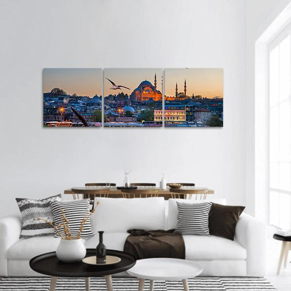 Istanbul Skyline at Dusk Panoramic Canvas Wall Art in gray, orange and blue, hung on a wall