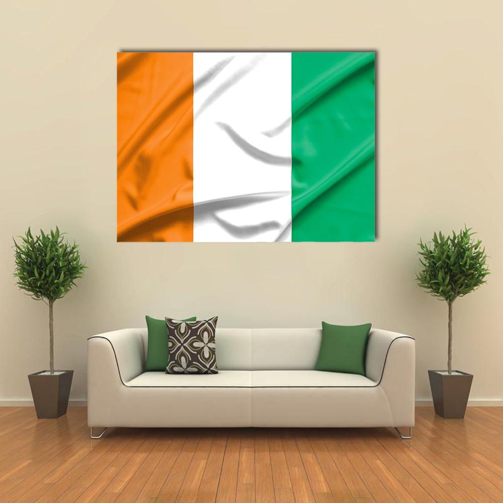 Ivory Coast Flag Canvas Wall Art in white, orange and green, single panel hung on a wall