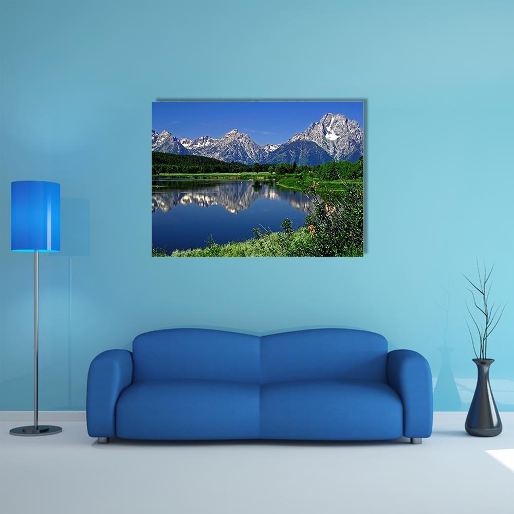 Jackson Lake Mountain Reflection Canvas Wall Art in white, green and blue, single panel hung on a wall