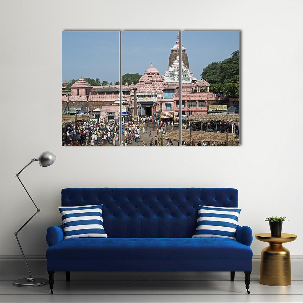 Jagannath Temple in Bustling Market Canvas Wall Art in brown, blue and pink, 3 panel horizontal set hung on a wall