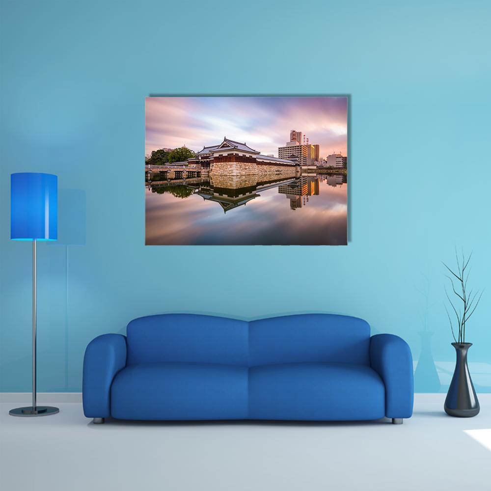 Japan Castle Moat at Sunset Canvas Wall Art in orange, blue and purple, single panel hung on a wall