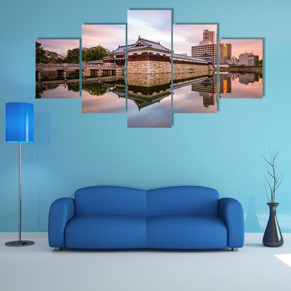 Japan Castle Moat at Sunset Canvas Wall Art in orange, blue and purple, 5 panel Star layout hung on a wall