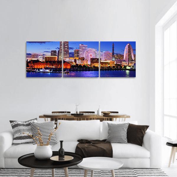Yokohama Skyline at Night Panoramic Canvas Wall Art in orange, yellow and blue, hung on a wall