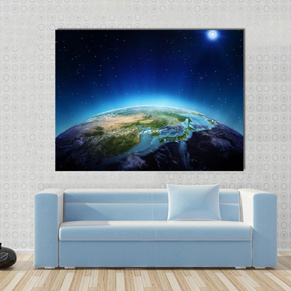 Blue Planet Earth from Space Canvas Wall Art in black and blue, single panel hung on a wall