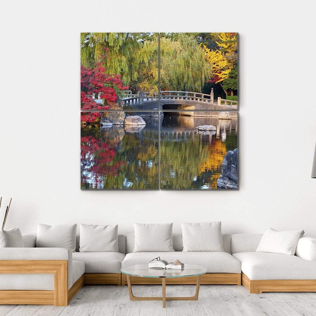 Japanese Pond with Arched Stone Bridge Canvas Wall Art in red, yellow and green, hung on a wall