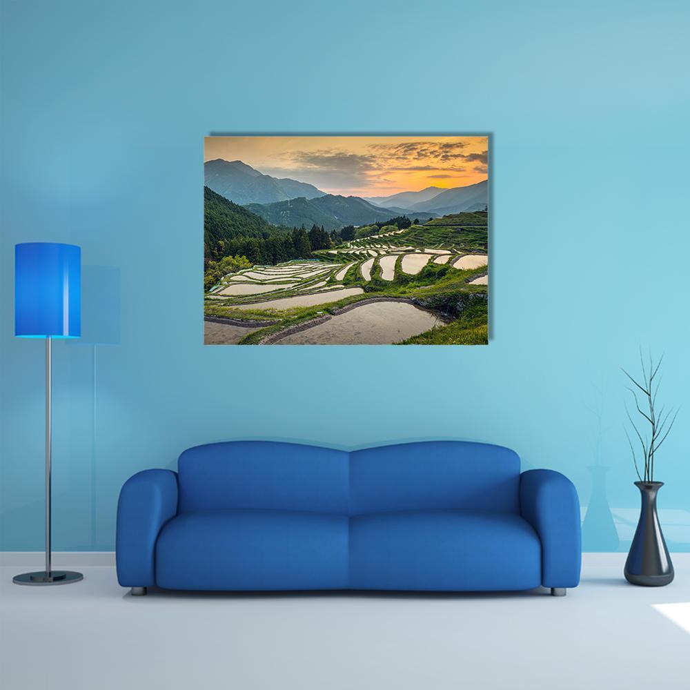 Japanese Rice Terraces Canvas Wall Art in yellow, green and blue, single panel hung on a wall