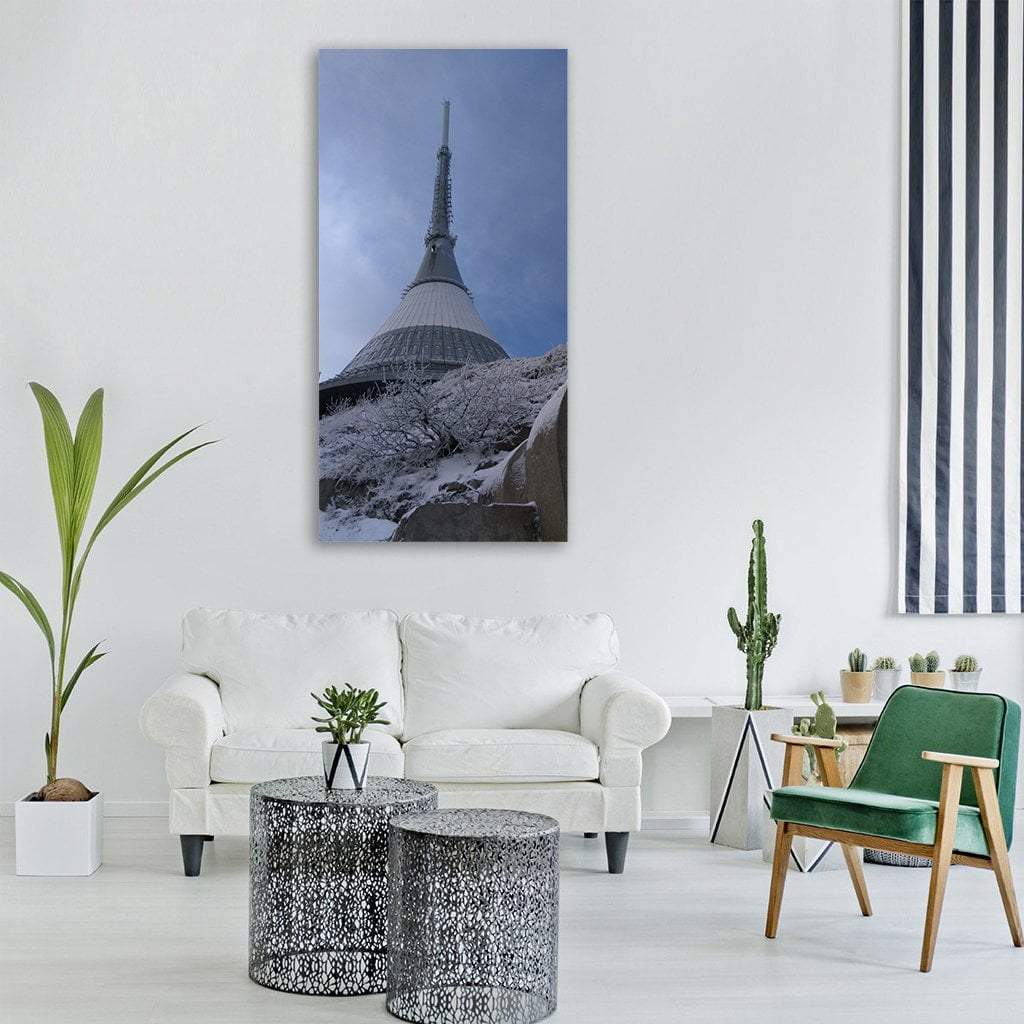 Ještěd Tower in Winter Vertical Canvas Wall Art in white, gray and blue, single vertical panel hung on a wall