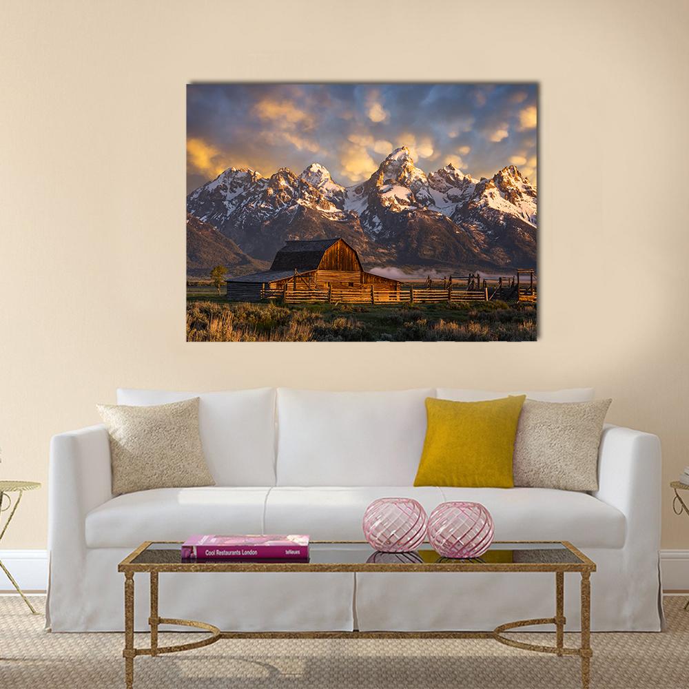 John Moulton Barn Canvas Wall Art in brown, yellow and blue, single panel hung on a wall