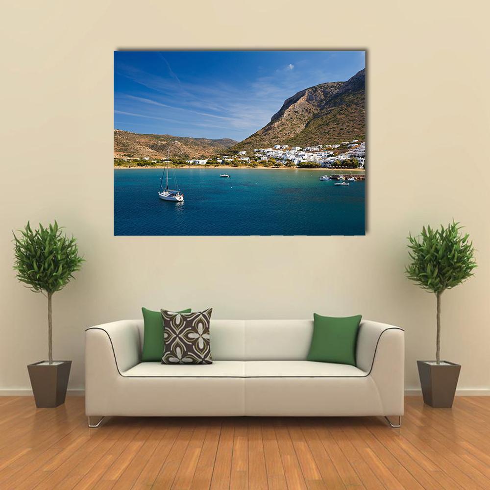 Kamares Beach and Village Canvas Wall Art in beige, brown and blue, single panel hung on a wall