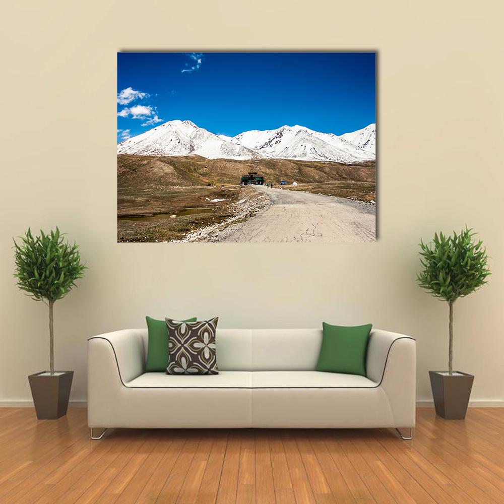 Karakoram Mountain Range Canvas Wall Art in white, brown and blue, single panel hung on a wall