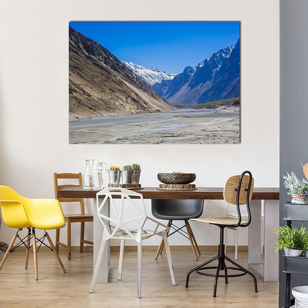 Karakorum Mountains in Clear Blue Sky Canvas Wall Art in gray, brown and blue, single panel hung on a wall