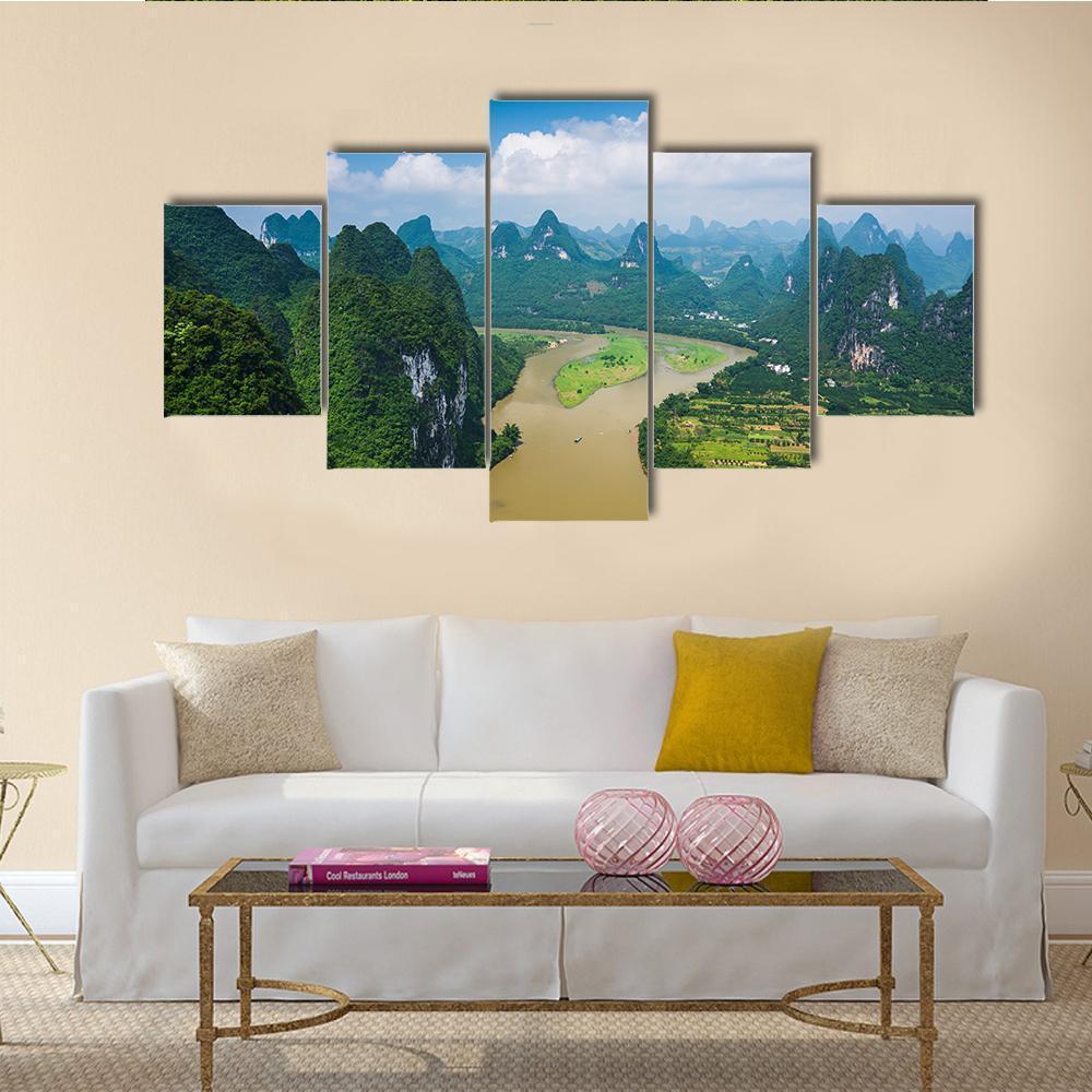 Karst Mountains with River and Rice Fields Canvas Wall Art in brown, green and blue, 5 panel Star layout hung on a wall