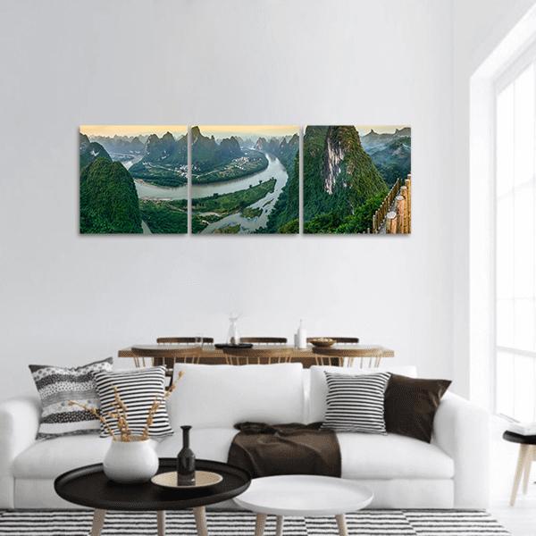 Horseshoe River Bend Among Karst Peaks Panoramic Canvas Wall Art in beige, green and blue, hung on a wall