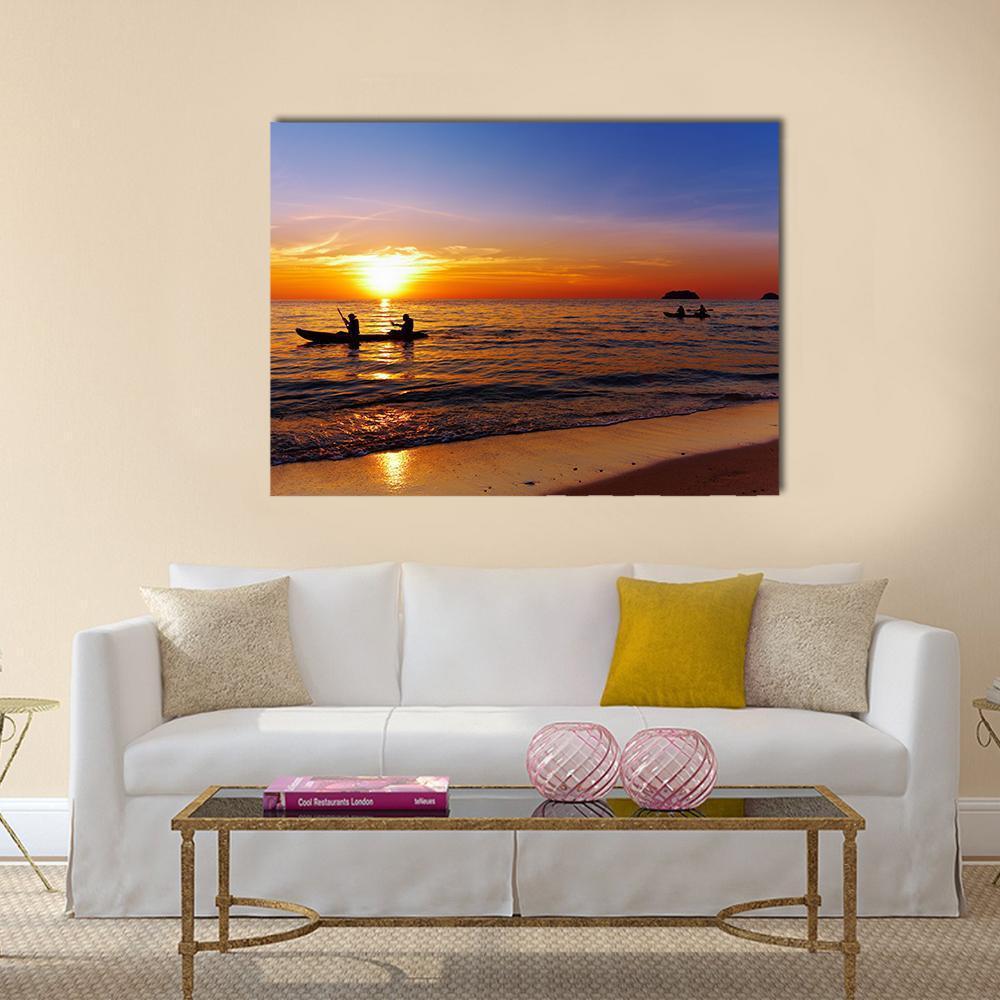 Kayakers at Sunset Canvas Wall Art in orange, yellow and blue, single panel hung on a wall