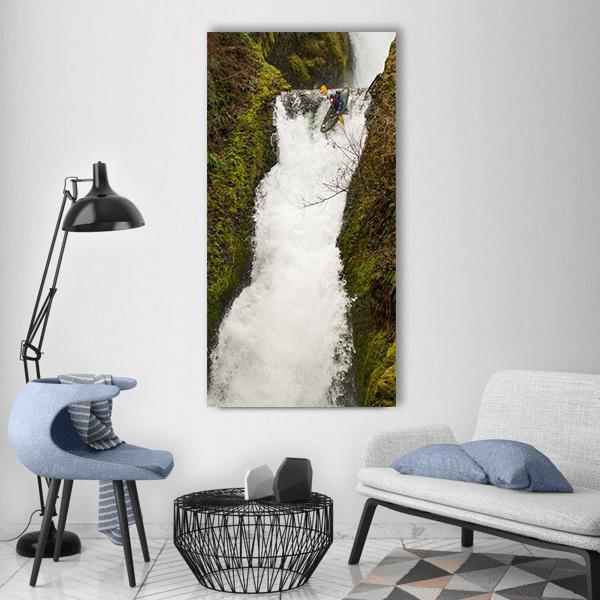 Kayaker at Oregon Waterfall Vertical Canvas Wall Art in white, brown and green, single vertical panel hung on a wall