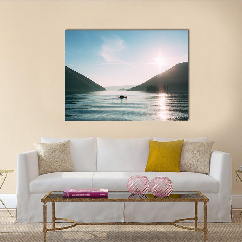 Kayaker at Sunset on Mountain Lake Canvas Wall Art in white and blue, single panel hung on a wall