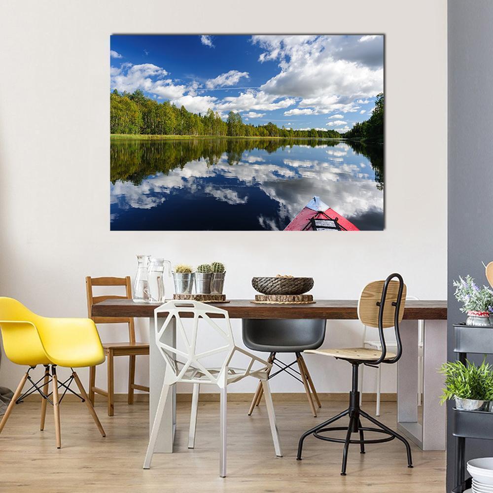 Kayaking on a Serene River Canvas Wall Art in white, green and blue, single panel hung on a wall