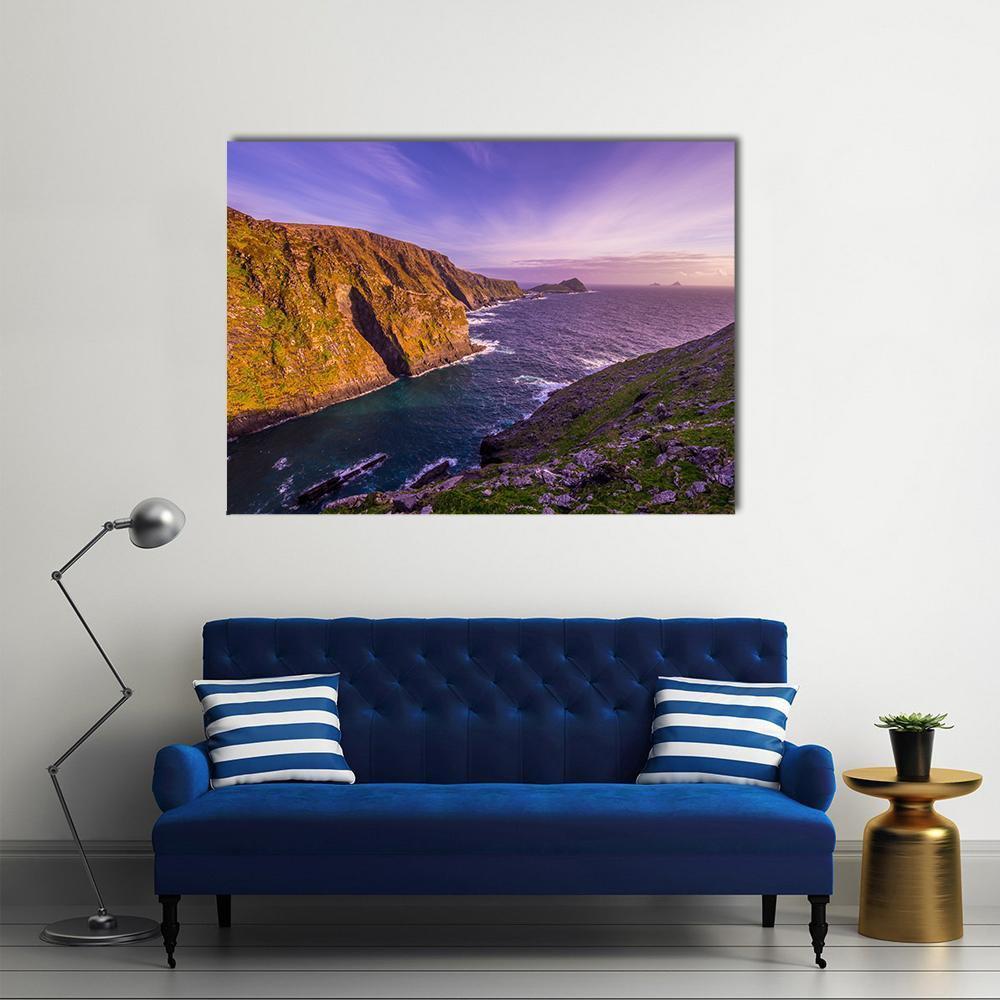 Kerry Cliffs Ireland at Sunset Canvas Wall Art in orange, blue and purple, single panel hung on a wall
