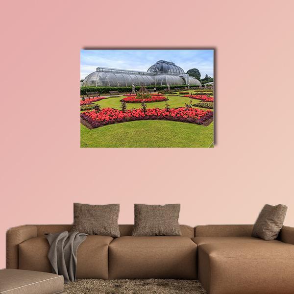 Kew Garden Greenhouse with Flower Beds Canvas Wall Art in gray, red and green, single panel hung on a wall