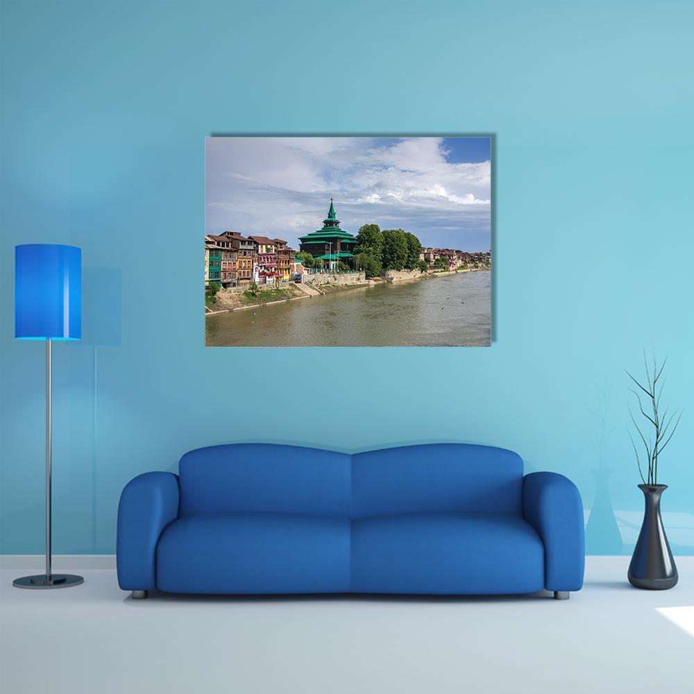 Khanqah-e-moula Mosque at Riverfront Canvas Wall Art in brown, green and blue, single panel hung on a wall