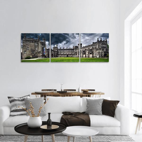 Kilkenny Castle Ireland Panoramic Canvas Wall Art in gray, green and blue, hung on a wall
