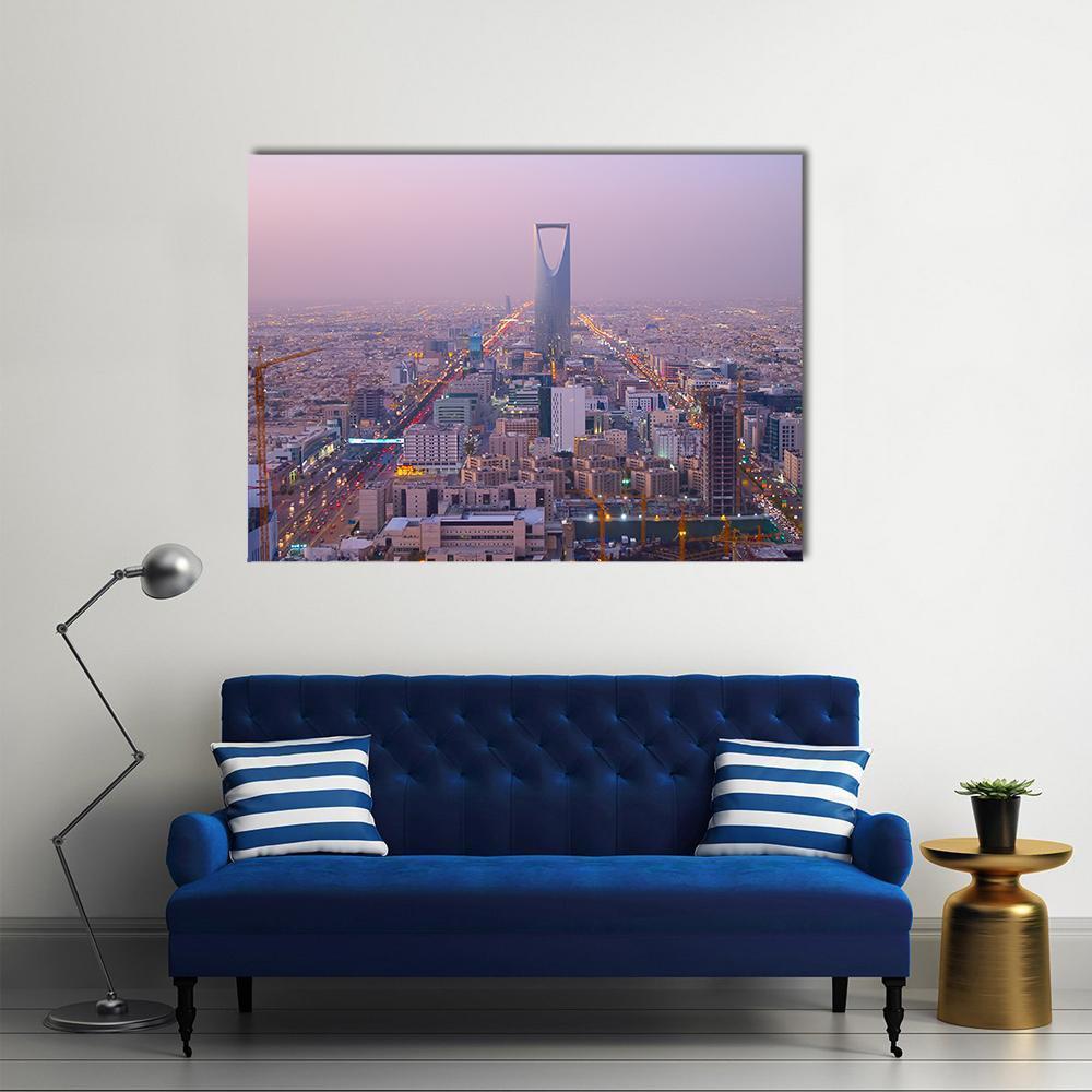 Kingdom Tower Riyadh Night Skyline Canvas Wall Art in gold, purple and pink, single panel hung on a wall