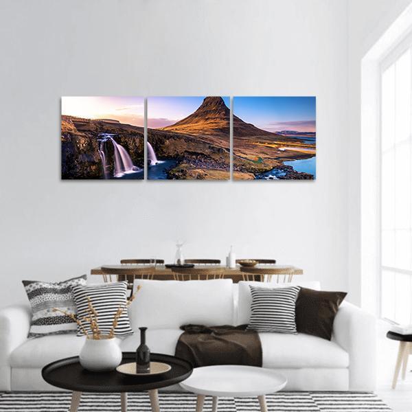 Kirkjufell Waterfall and Mountain Panoramic Canvas Wall Art in brown, orange and blue, hung on a wall